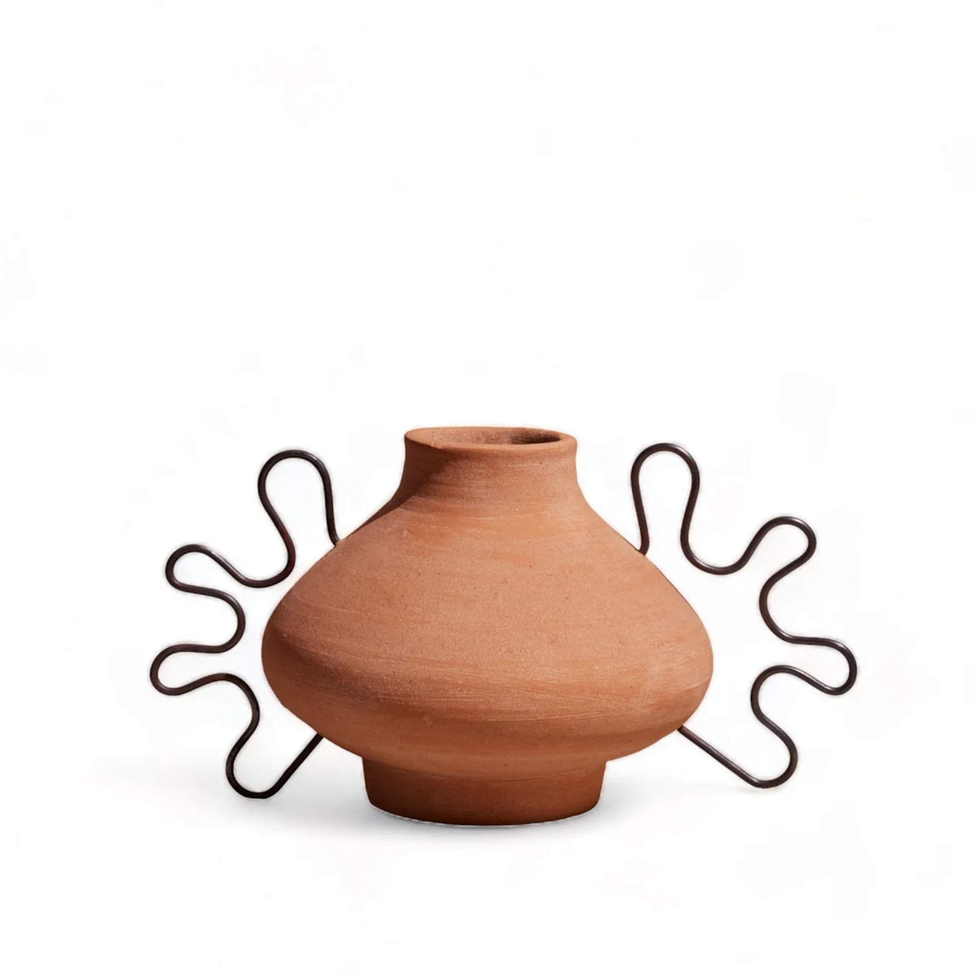 Sustainable home décor ethically made in Honduras. Unique decorative vase sculpture made of artisan-crafted terracotta.
A sculptural home accent and terracotta and iron vessel made-to-order décor piece. Timeless earthy design and skilled craftsmanship.
