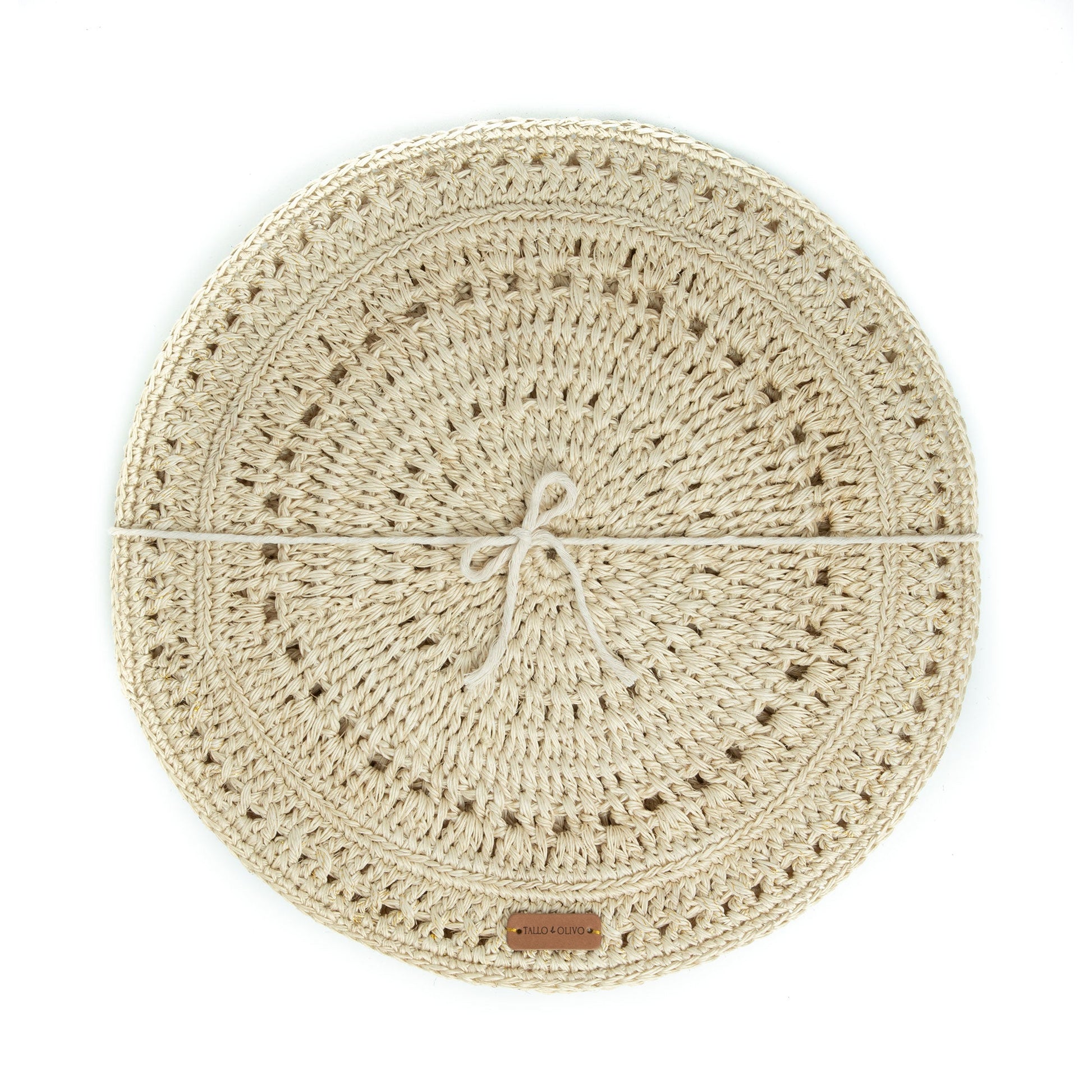 Close-up of a single Fique Pacific Placemat – A round, handwoven placemat made from natural fique fiber, showcasing its intricate, textured weave in a neutral tone.