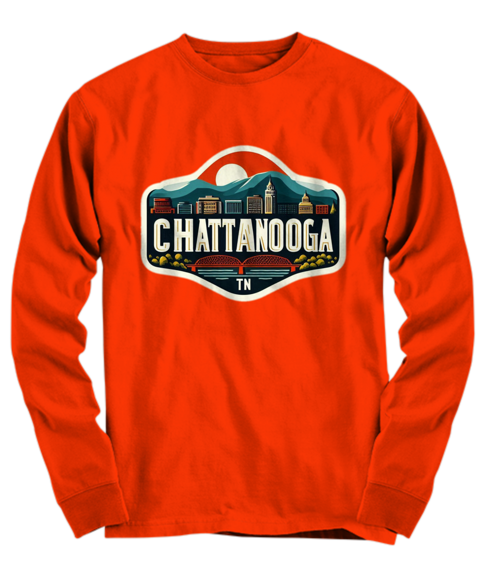 Orange long-sleeved T-shirt featuring a classic Chattanooga, TN design is bold, coordinating colors. The shirt is made from 100% pre-shrunk cotton, with shoulder-to-shoulder taping and ribbed cuffs for a comfortable and durable fit. The vibrant orange color and clean, seamless finish offer a stylish and cozy casual look.