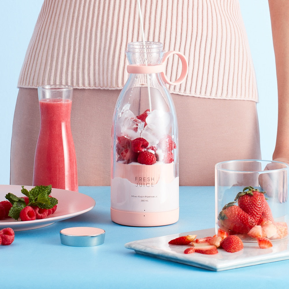 A delicious-looking serving suggestion of strawberries and cream smoothie making.